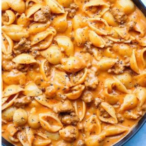 A close up of pasta with meat in sauce