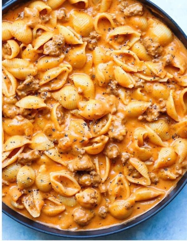 A close up of pasta with meat in sauce