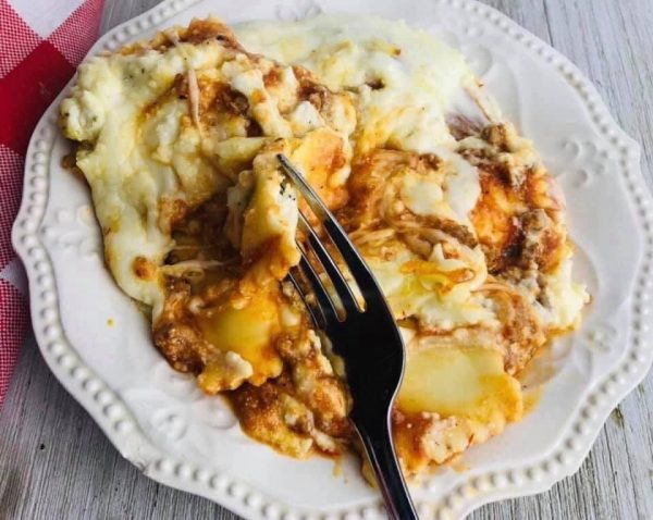 A plate of food with some meat and cheese on it