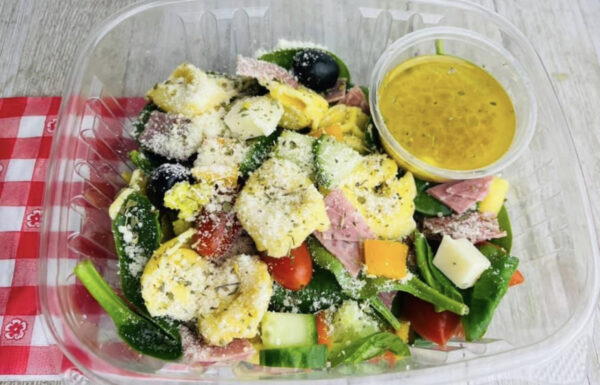 A salad with dressing in the middle of it.