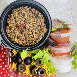 A plastic container with food in it