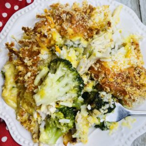 A plate of food with rice and broccoli.